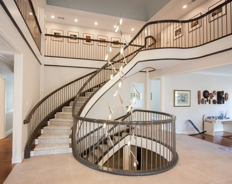 spiral staircase with custom chandelier