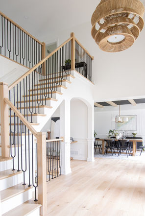 Foyer with arch under staircase