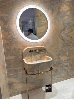 curved sink with round mirror