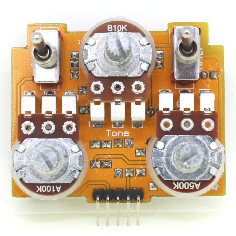 front view of completed guitar pedal circuit board with knob posts and switches