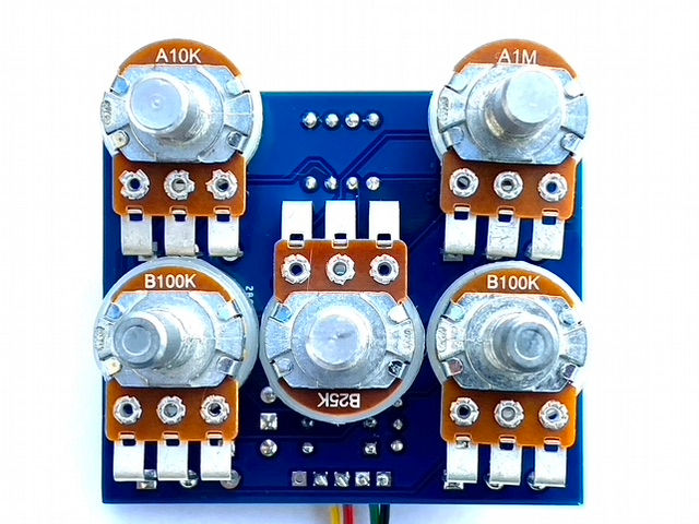 front view of completed guitar pedal circuit board with knob posts