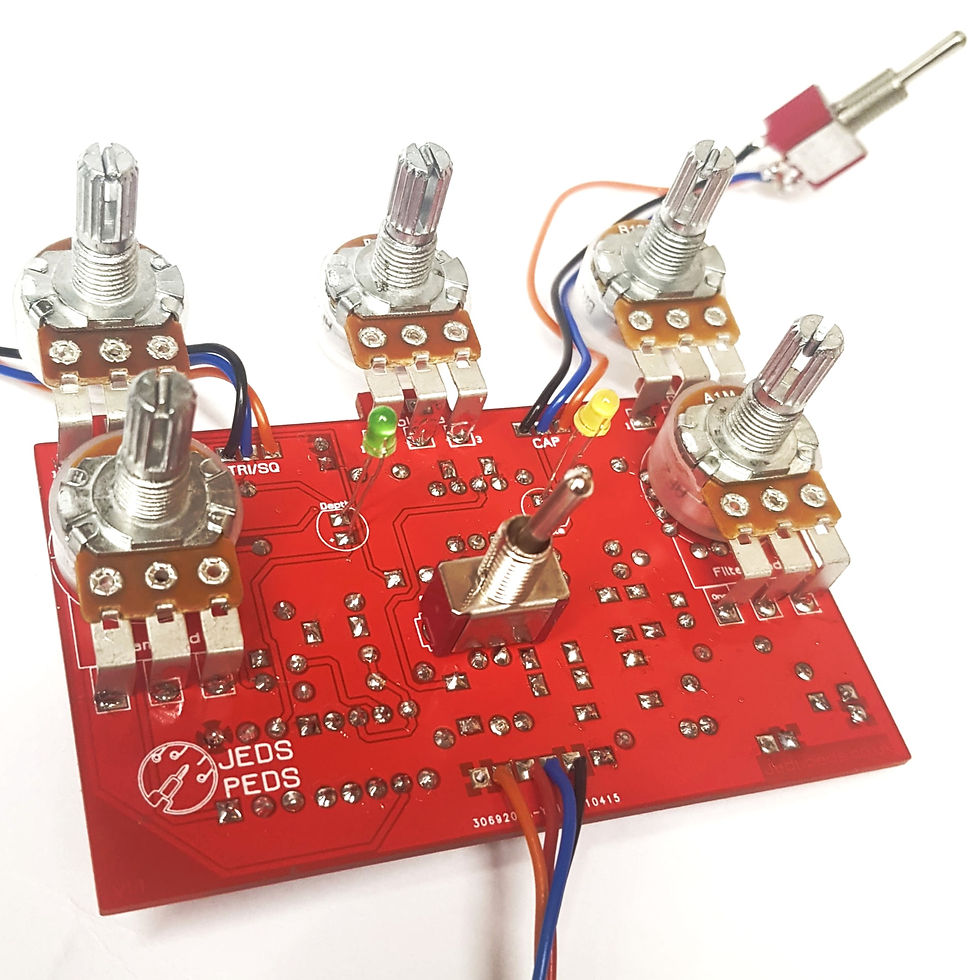 front view of completed guitar pedal circuit board with knob posts