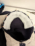 Wadding pinned inside a sleeve head of a coat
