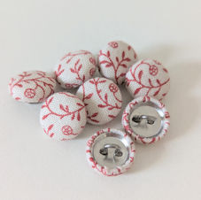 Cream and red fabric covered buttons