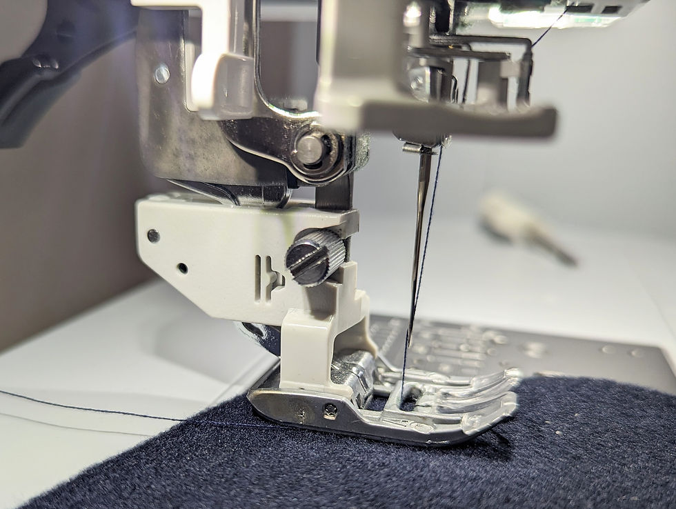A walking foot on a sewing machine