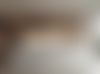 Eye-level view of a modern kitchen with custom cabinets and sleek countertops