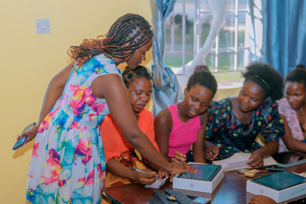 Monica Mulwafu (left) facilitating a digital business class at Kachila Centre in Karonga district
