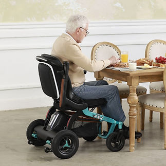 man in wheelchair sitting at table