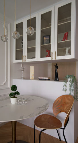 Victorian Interiors - A dining area with a display on top & shoe cabinet below.
