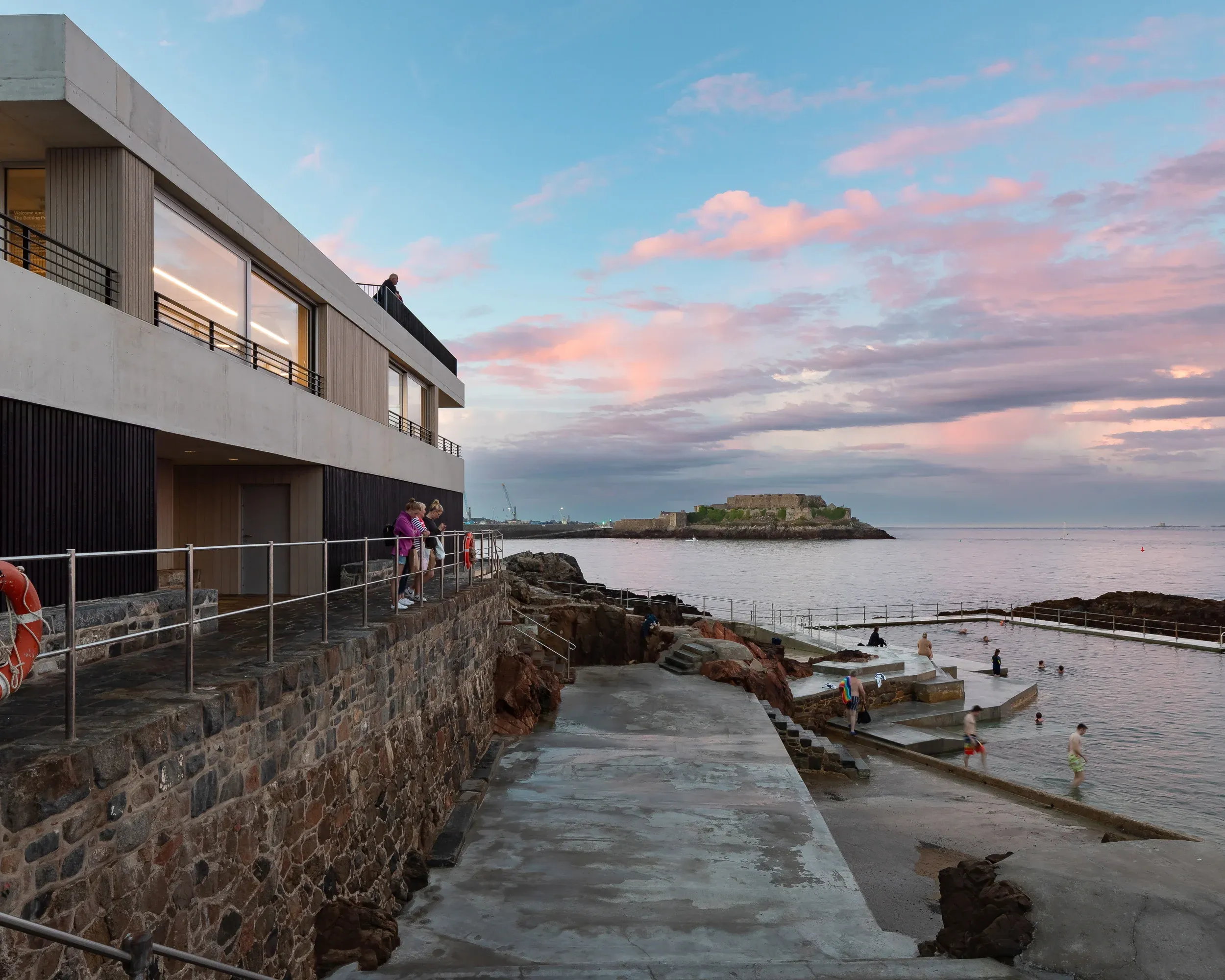 Exterior view of the bathing pools, built by DLM Architects, highlighting how the design fosters community engagement and social value.