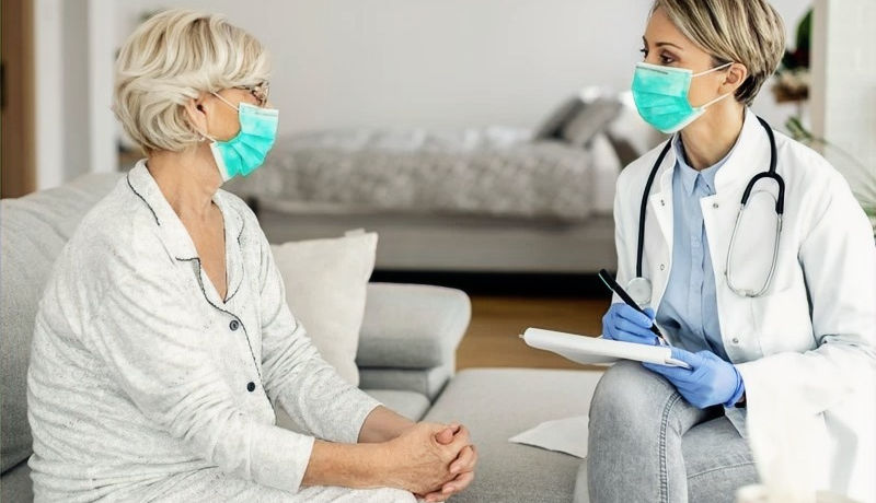 female-doctor-senior-woman-wearing-face-masks-during-home-visit_edited.jpg