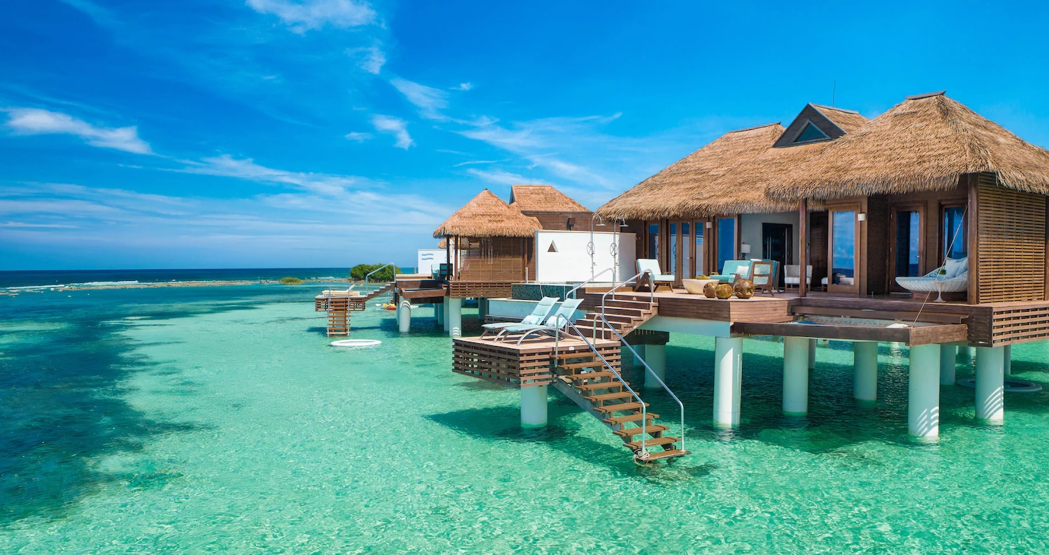 Overwater bungalow at Sandals Royal Caribbean at sunset
