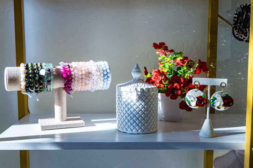 Multicolored bracelets and rose-toned gemstone earrings displayed at The Mustard Seed in Siloam Springs.