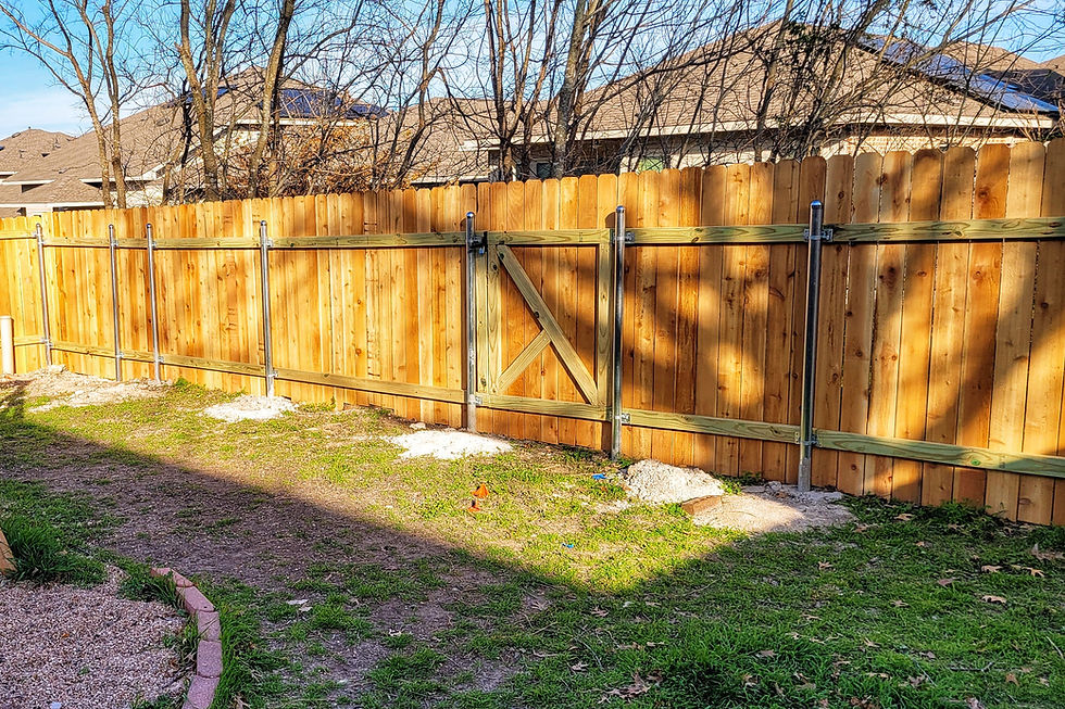 A wood privacy fence with metal posts built by handyman Leander tx