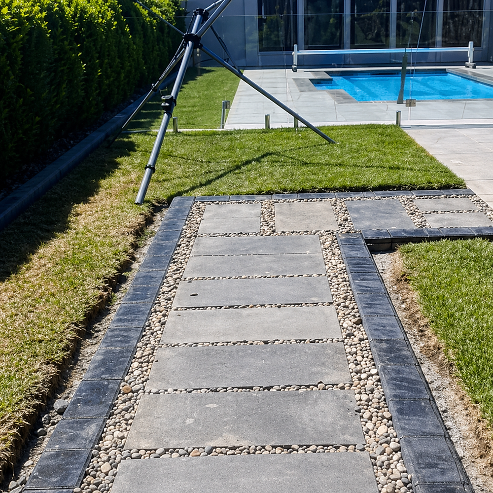 Decorative concrete edging and paver path in Gippsland kwik kerb