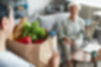 A senior with groceries