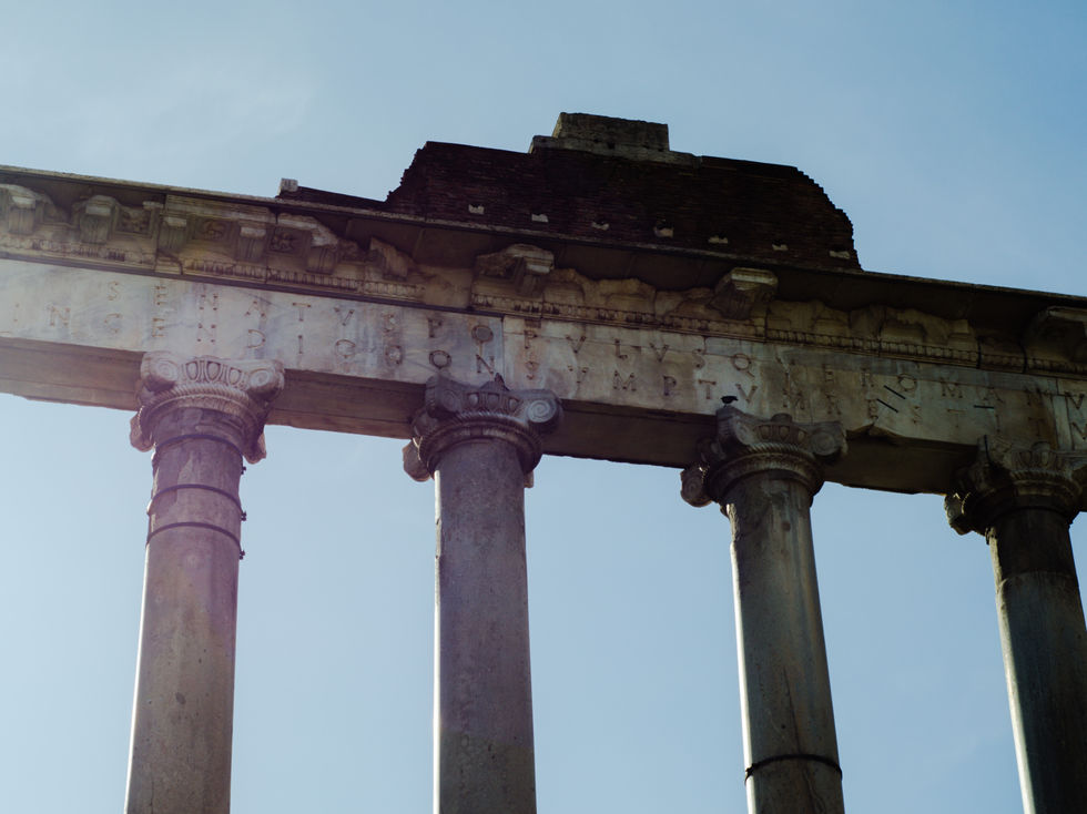 Ancient Roman columns in ruins, enduring as silent witnesses to history, time, and architectural heritage.
