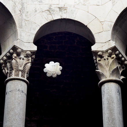 Ancient healing baths where water was once considered medicine, now preserved ruins evoking steam, voices, and ritual care.