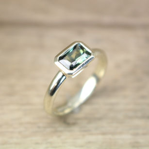 Radiant cut green-blue-yellow sapphire in 9ct Fairmined white gold