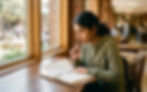 High school student journaling by a sunlit window, reflecting on how to stand out in her college application