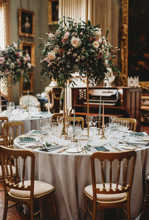 Tall table flowers for a wedding at Somerley House