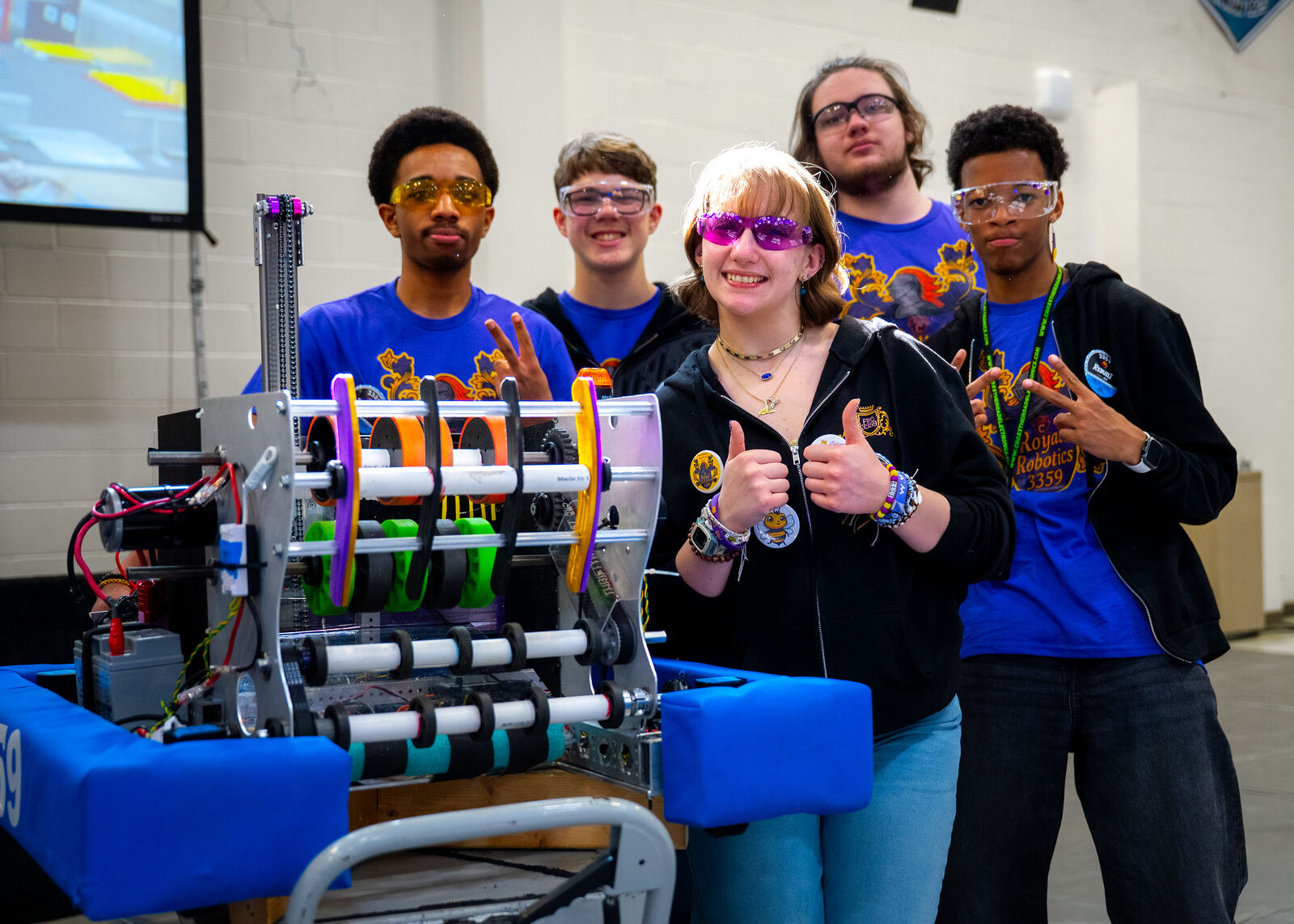A team gathers around its robot