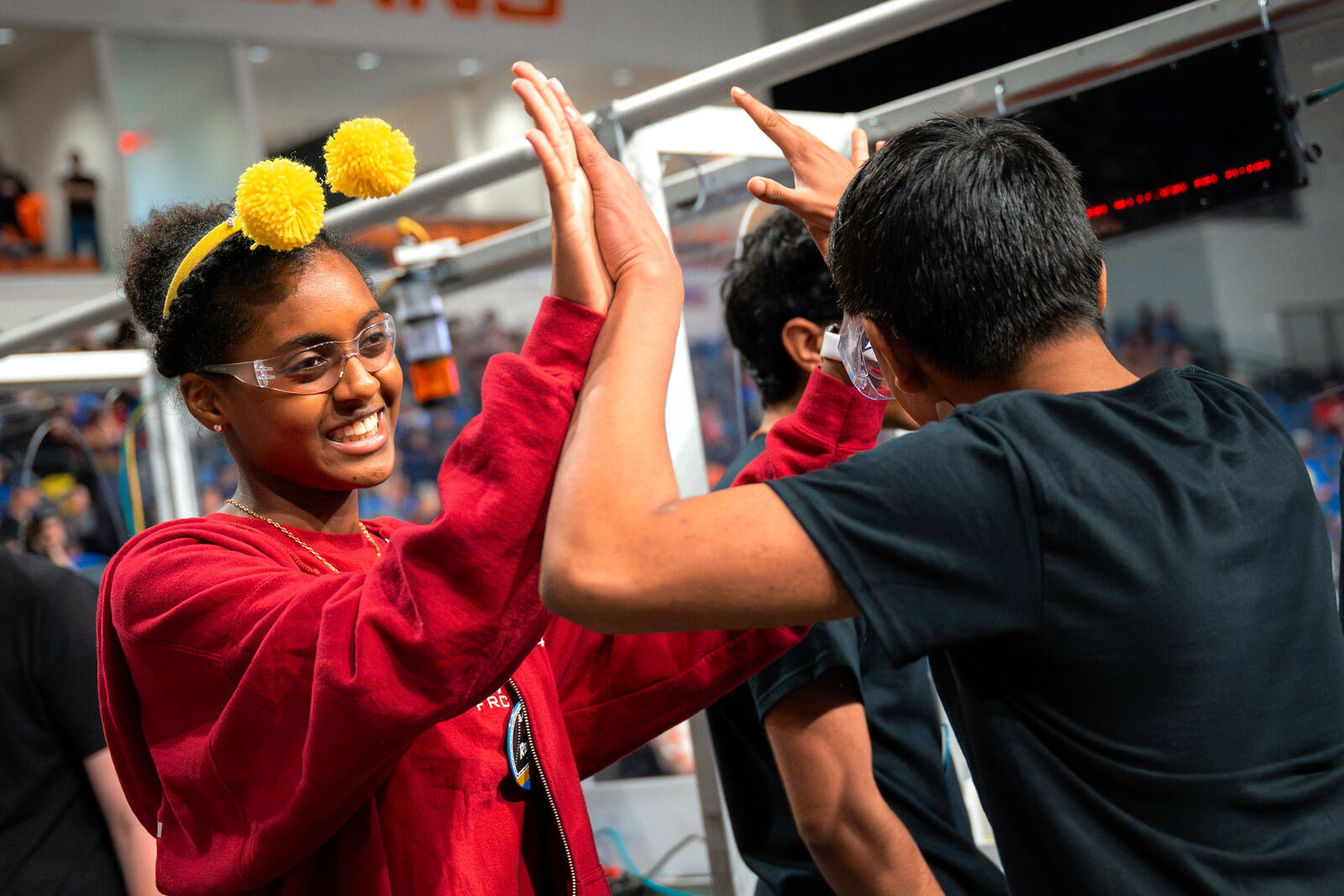 Students high-five after a match