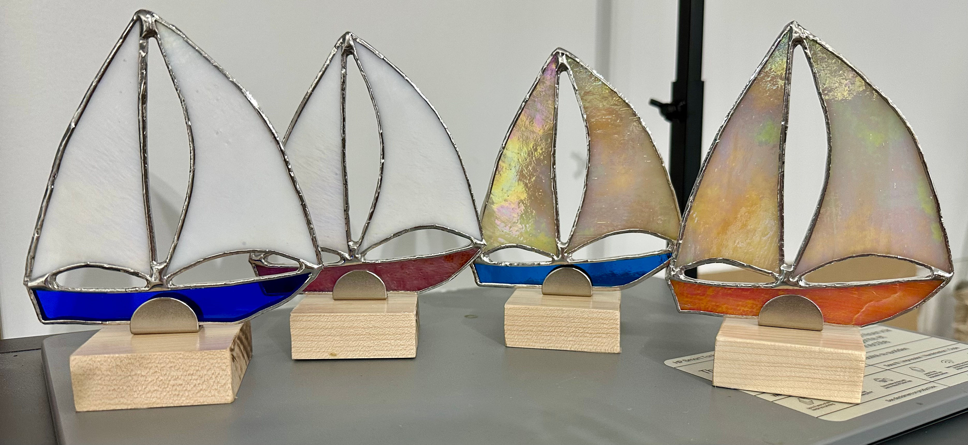 Multi-Colored Sailboats on wooden stand