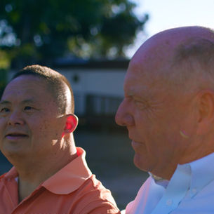 Koji and Dr. Buckley enjoy golden hour in The Roland Center's tranquility garden.