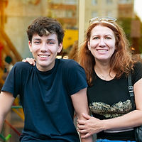 Boy of adolescence with his mother talk, laugh, have fun together all evening at sunset in