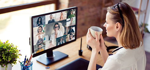 Back view photo of woman worker have webcam group conference with her coworkers on modern