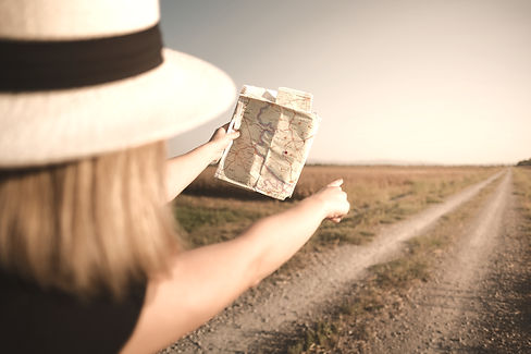 woman with map in road trip, hiking in nature_edited.jpg