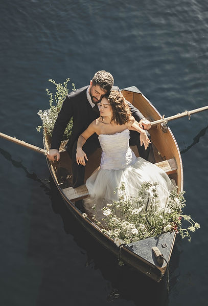 Bride and groom in boat at Euridge Manor
