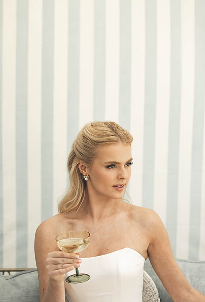 Bride drinking champagne at Cornwell Manor