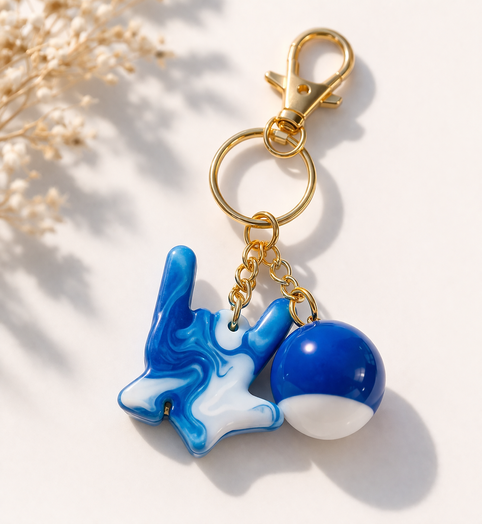 A closeup photo of a blue love sign charm