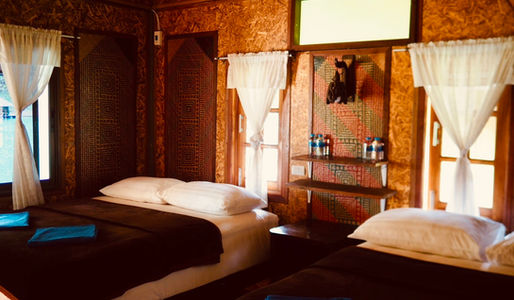 Family floating room at Praiwan Raft House with private veranda and lake views on Cheow Lan Lake, Khao Sok National Park.