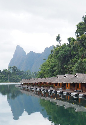 Praiwan Raft House
Praiwan Raft House on Cheow Lan Lake in Khao Sok National Park with authentic floating bungalows surrounded by rainforest and limestone mountains.
