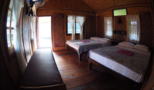 Family floating room at Praiwan Raft House with private veranda and lake views on Cheow Lan Lake, Khao Sok National Park.