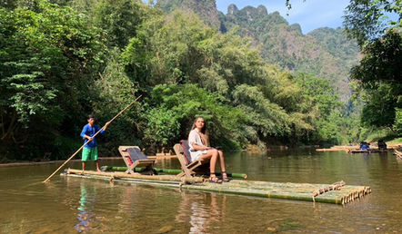 Bamboo rafting through the rainforest river in Khao Sok National Park