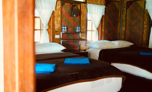 Family floating room at Praiwan Raft House with private veranda and lake views on Cheow Lan Lake, Khao Sok National Park.