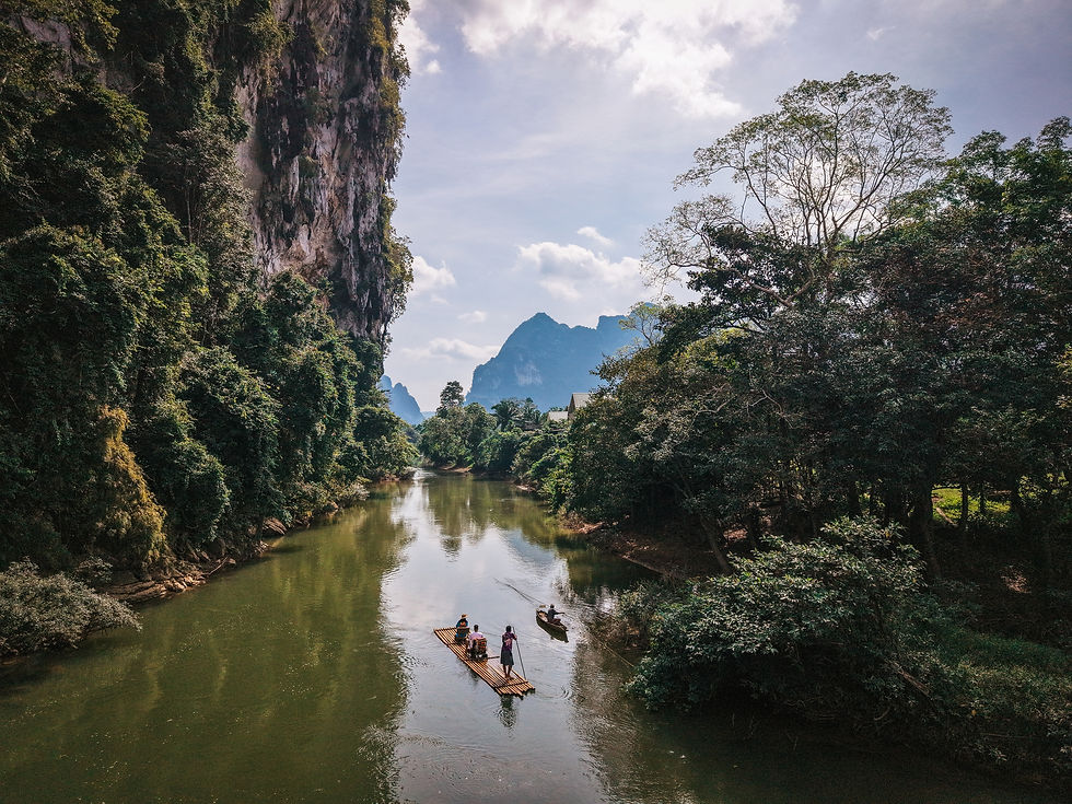 Experience bamboo rafting in Khao Sok National Park. Float along jungle rivers beneath limestone cliffs and discover authentic eco-adventures in Khao Sok, Thailand.