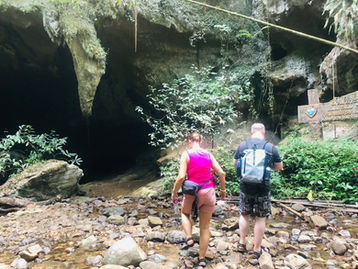 Enter Nam Talu Cave with your local guide and headlamp.