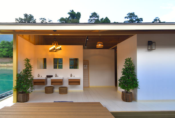 Modern floating villa interior overlooking tropical lake scenery