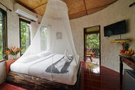 Cozy treehouse bedroom with rainforest atmosphere in Khao Sok National Park