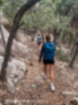 Descending through forest on the GR221 trail, a scenic stretch of Mallorca’s on-foot holiday routes.