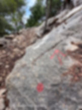 A red arrow marks the GR221 trail on the rocky path between Esporles and Valldemossa, Mallorca – part of the Dry Stone Route