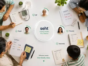 Family members review health records around a table with seht Family Health At a Glance, BP, lab reports, and vaccine notes. Track on seht.