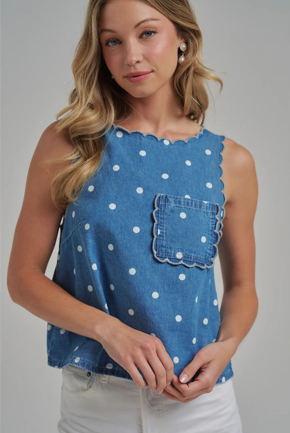 Thumbnail: A washed polka dot denim sleeveless top