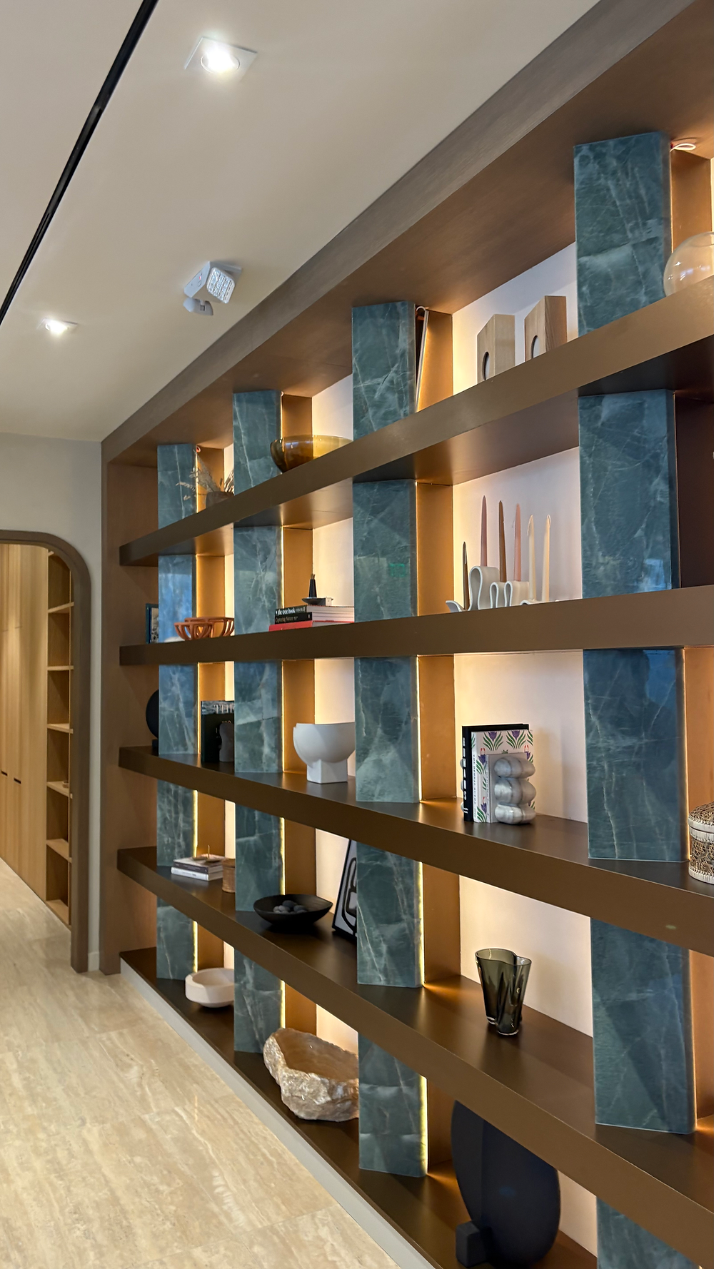 Modern luxury shelving unit with green stone accents