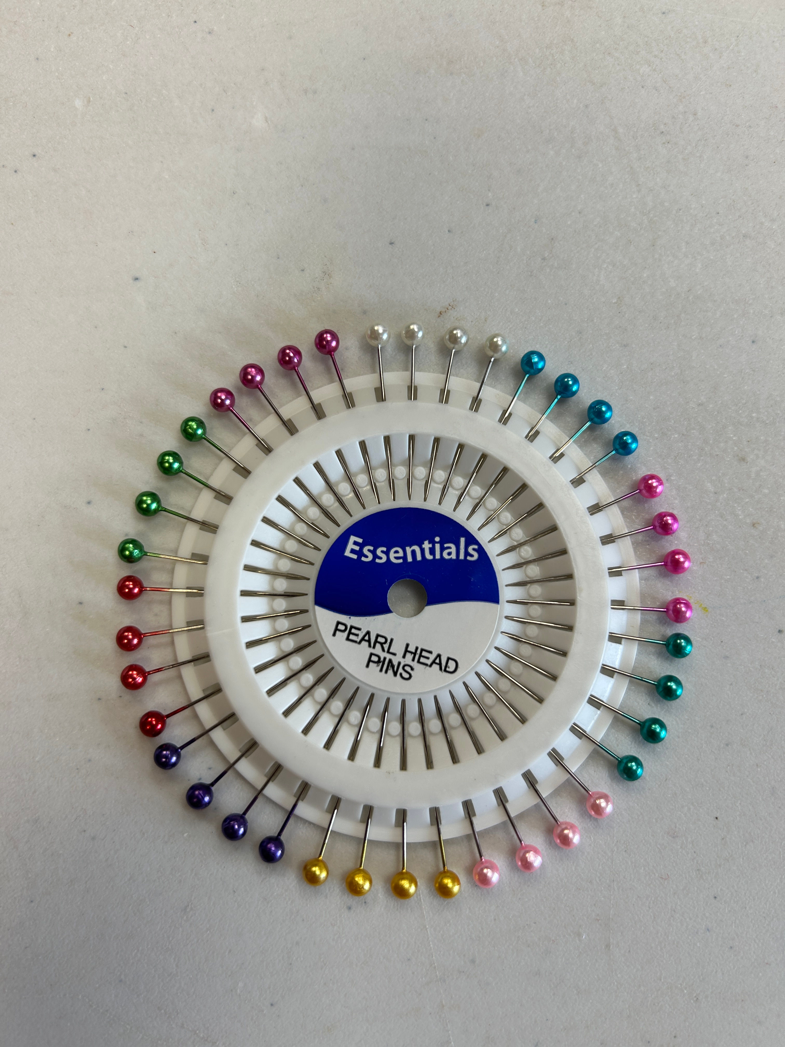 Pearl head pins on a wheel